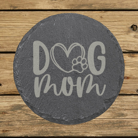 Round slate coaster laser engraved with a hand drawn Dog Mom heart and paw design