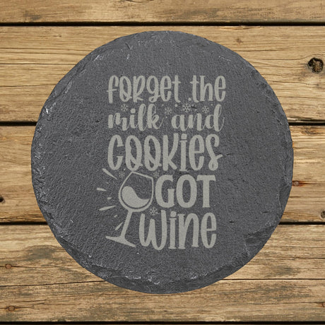 Round slate coaster laser engraved with "Forget the Milk and Cookies, I've Got Wine"