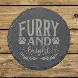 Round slate coaster laser engraved with "Furry and Bright", paws design
