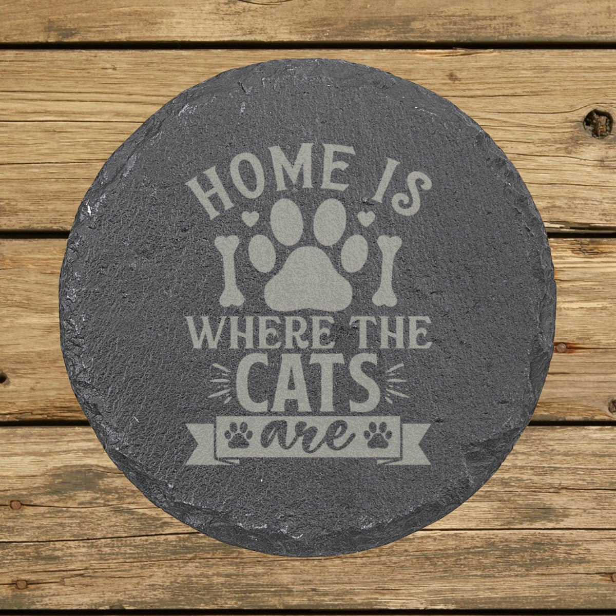 Round slate coaster laser engraved with "Home Is Where the Cats Are"