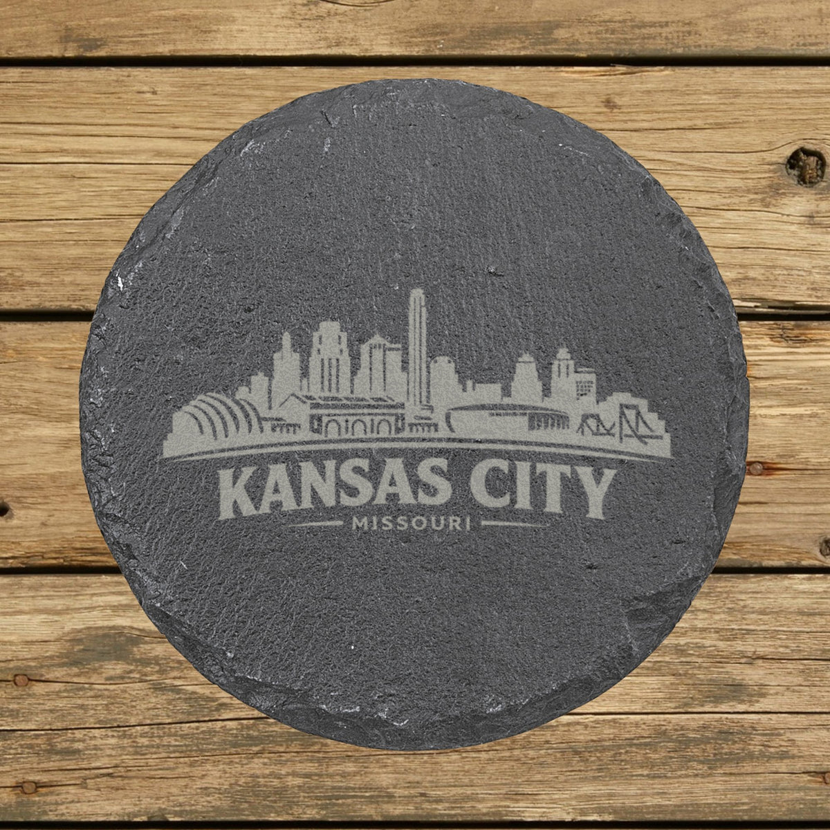 Round slate coaster laser engraved with the Kansas City, Missouri skyline