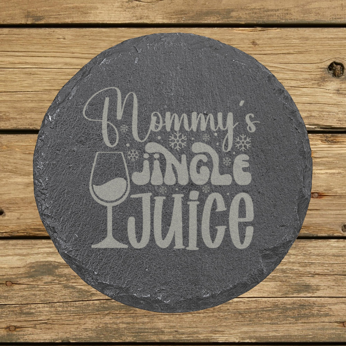 Round slate coaster laser engraved with "Mommy's Jingle Juice"