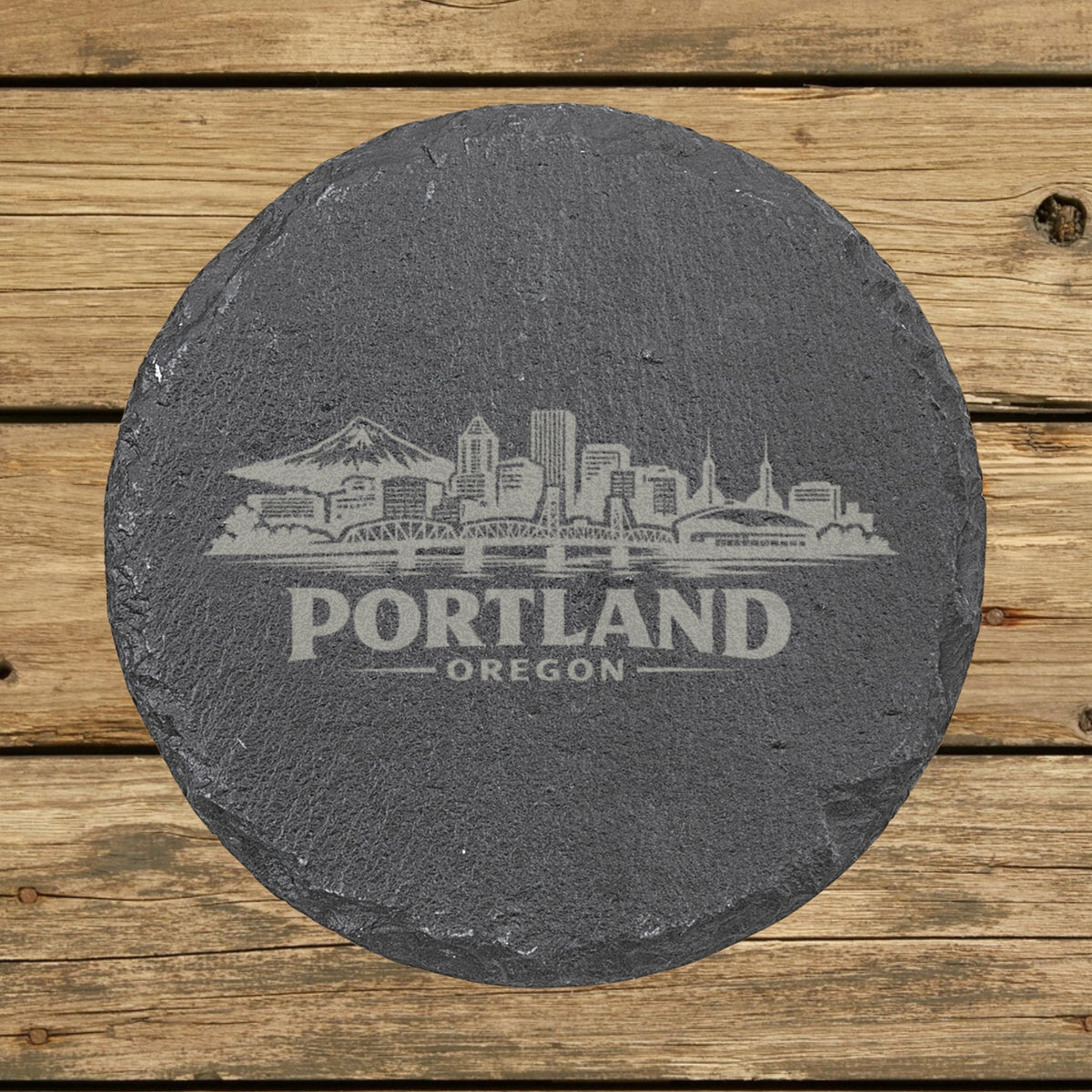 Round slate coaster laser engraved with the Portland, Oregon skyline