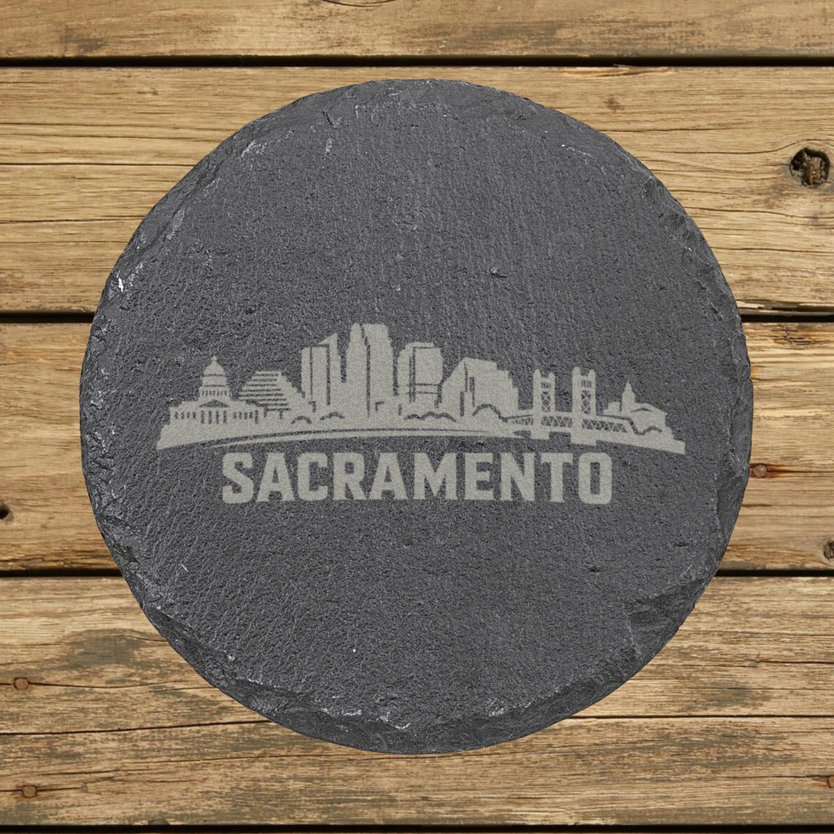 Round slate coaster laser engraved with the Sacramento, California skyline