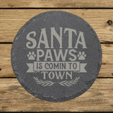 Round slate coaster laser engraved with "Santa Paws Is Comin' to Town"