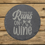 Round slate coaster laser engraved with "This Elf Runs on Wine"