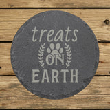Round slate coaster laser engraved with "Treats on Earth"