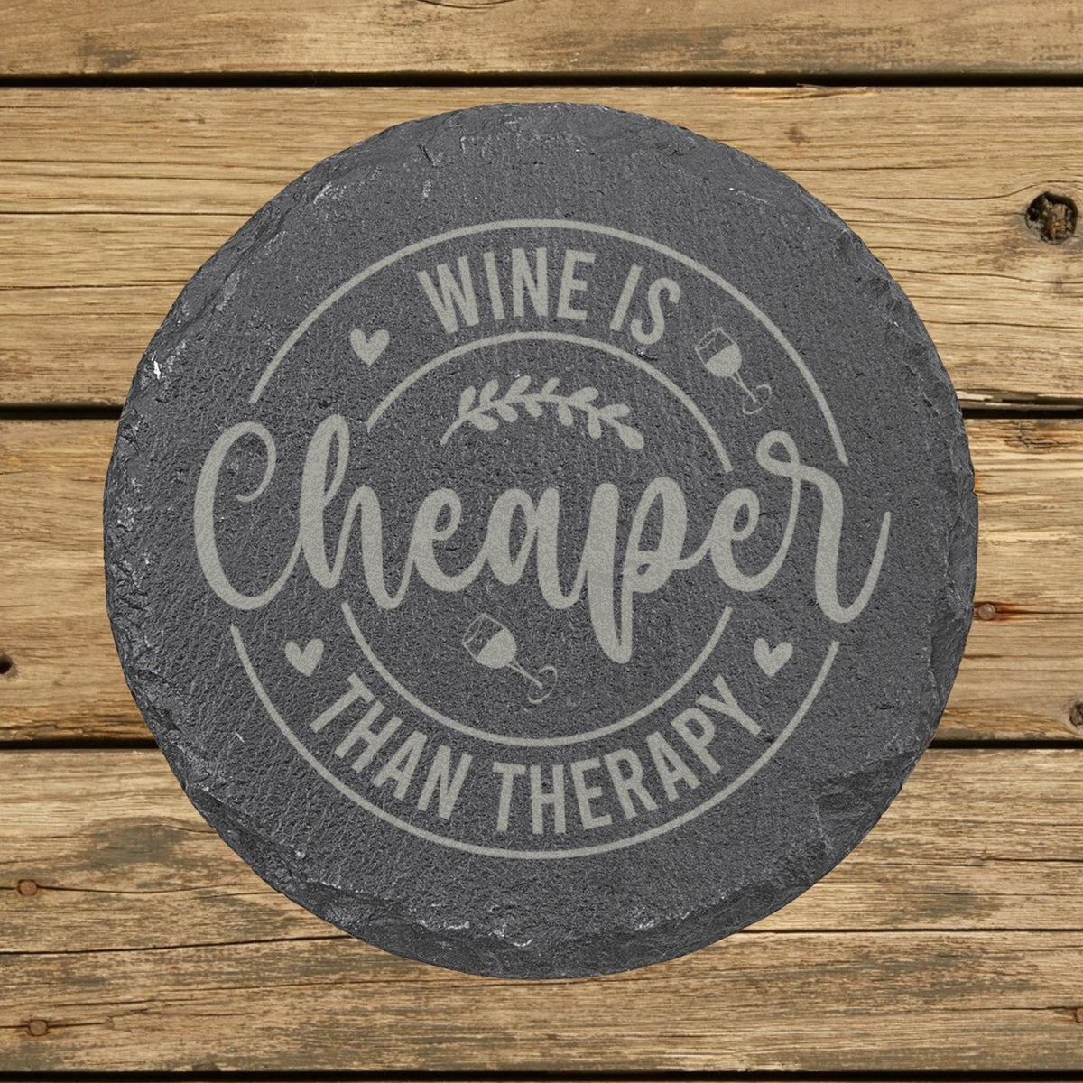 Round slate coaster laser engraved with "Wine Is Cheaper Than Therapy"