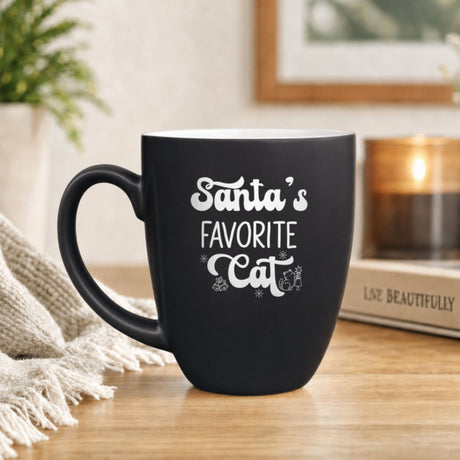 16 oz black ceramic coffee mug with "Santa's Favorite Cat"