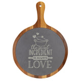 "The Secret Ingredient is Always Love" Round Acacia Wood/Slate Cutting Board - Laser Engraved