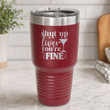 Maroon 30 oz tumbler laser engraved with "Shut Up Liver, You're Fine", on a kitchen counter