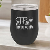 Black 12 oz stemless wine tumbler laser engraved with "Sip Happens", on a kitchen counter