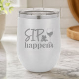 White 12 oz stemless wine tumbler laser engraved with "Sip Happens", on a kitchen counter