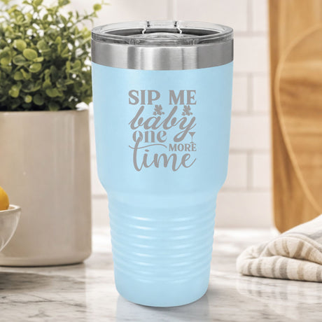 Light Blue 30 oz tumbler laser engraved with "Sip Me Baby One More Time", on a kitchen counter