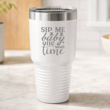 White 30 oz tumbler laser engraved with "Sip Me Baby One More Time", on a kitchen counter