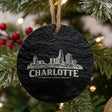Charlotte, North Carolina skyline engraved on a round slate Christmas ornament