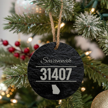 Round slate Christmas ornament laser engraved with a custom zip code design