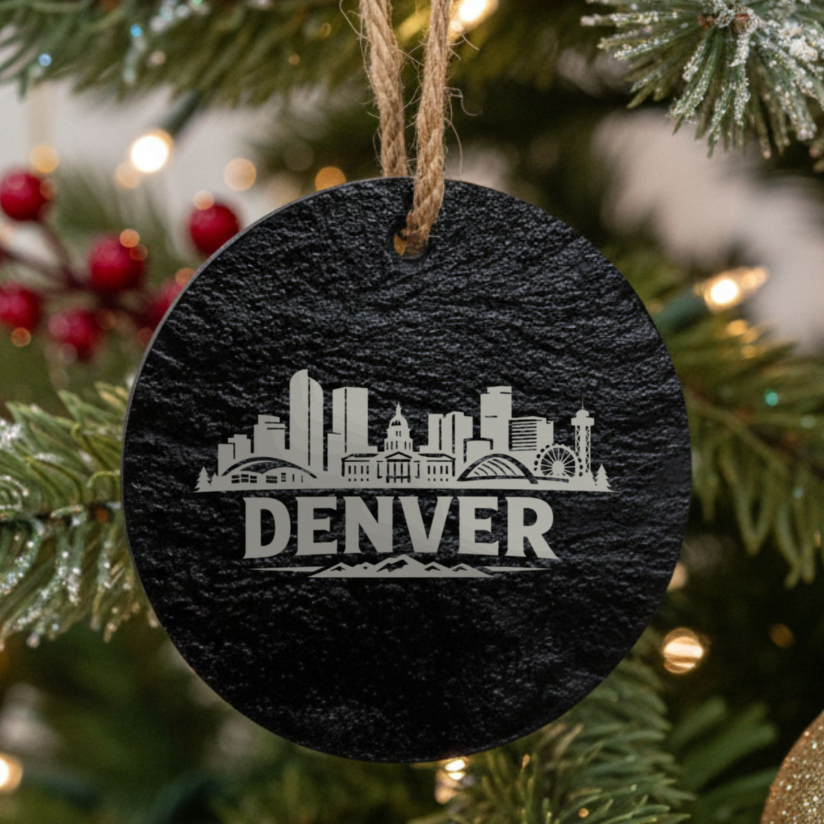 Denver, Colorado skyline engraved on a round slate Christmas ornament