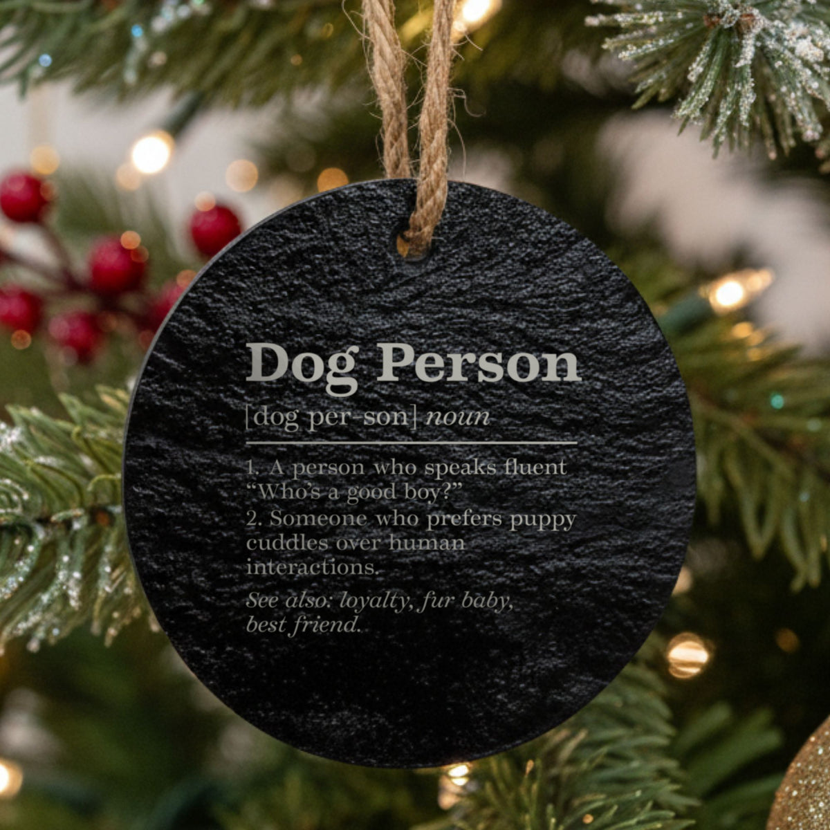Round black slate Christmas ornament laser engraved in white with the Dog Person dictionary definition