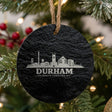 Durham, North Carolina skyline engraved on a round slate Christmas ornament