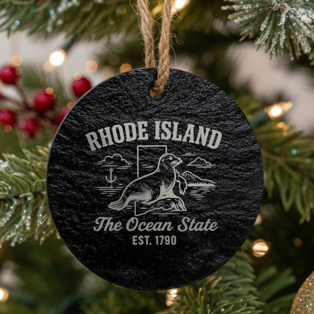 Round slate Christmas ornament laser engraved with a Rhode Island design of a harbor seal and an anchor