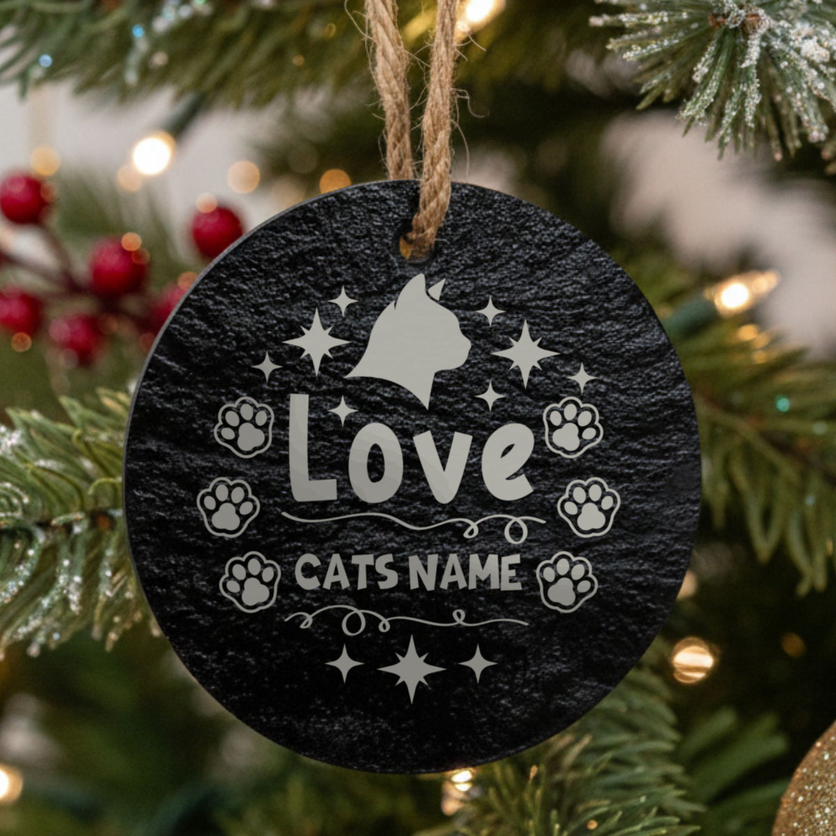 Round slate Christmas ornament engraved Love with a cat silhouette, stars and paw prints, showing where your cat's name goes
