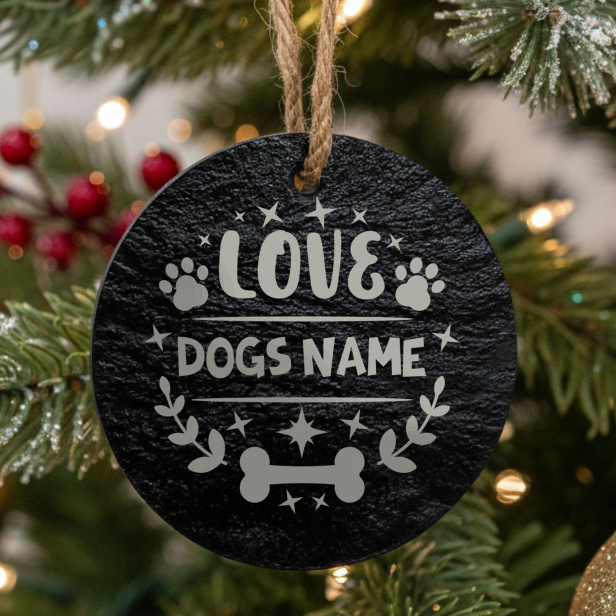 Round slate Christmas ornament engraved LOVE with paw prints, a bone and a laurel, showing where your dog's name goes