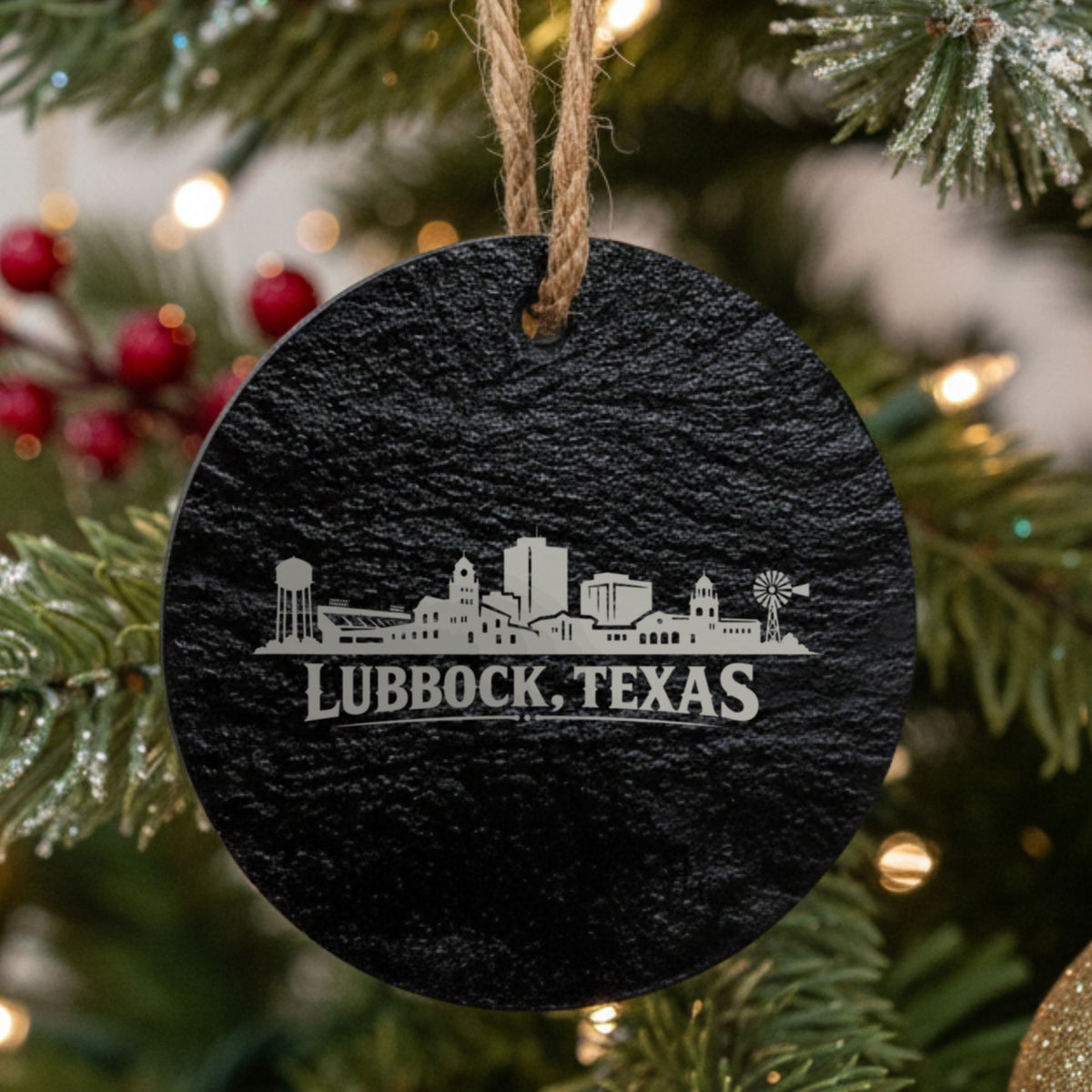Lubbock, Texas skyline engraved on a round slate Christmas ornament