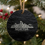 Seattle, Washington skyline engraved on a round slate Christmas ornament