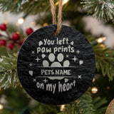 Round slate Christmas ornament engraved You left paw prints on my heart with a split paw print, showing where your pet's name goes