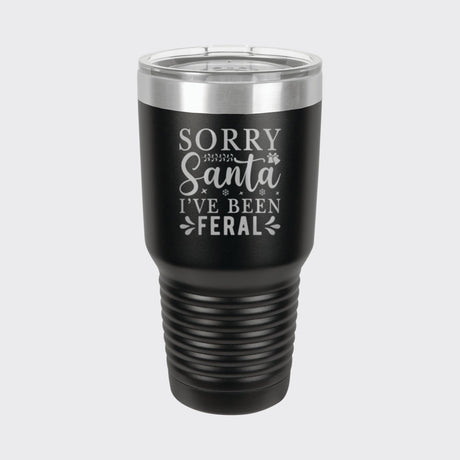 Black 30 oz tumbler laser engraved with "Sorry Santa, I've Been Feral"