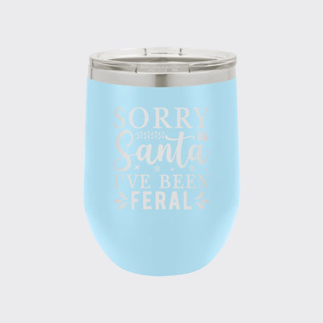 Light Blue 12 oz stemless wine tumbler laser engraved with "Sorry Santa, I've Been Feral"