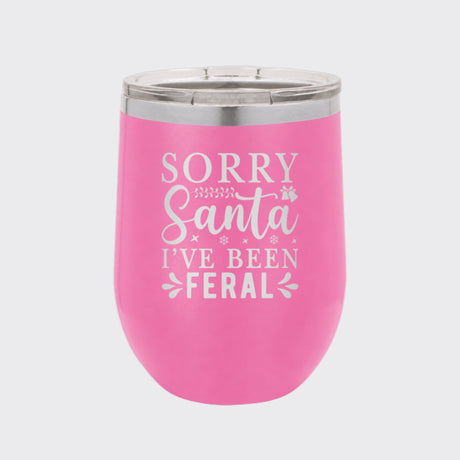 Pink 12 oz stemless wine tumbler laser engraved with "Sorry Santa, I've Been Feral"