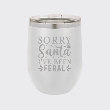White 12 oz stemless wine tumbler laser engraved with "Sorry Santa, I've Been Feral"