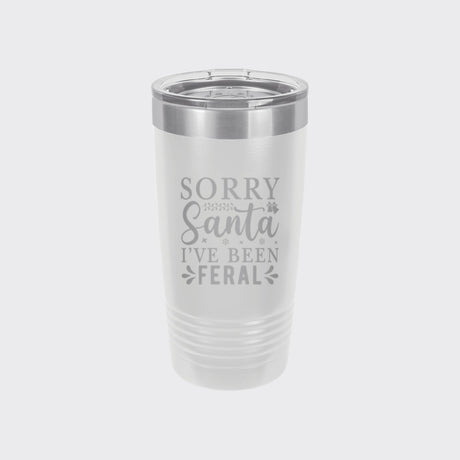 White 20 oz tumbler laser engraved with "Sorry Santa, I've Been Feral"