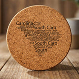 South Carolina round cork coaster engraved with a word cloud of repeating South Carolina text