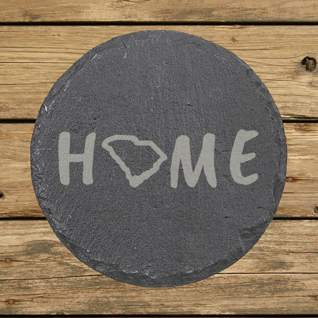 South Carolina round slate coaster engraved with HOME using the state outline as the letter O