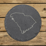 South Carolina round slate coaster engraved with the state outline and home in script with a heart