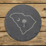South Carolina round slate coaster engraved with the state outline, palmetto tree and crescent moon