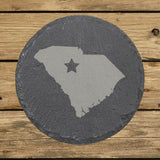 South Carolina round slate coaster engraved with the state shape and a star
