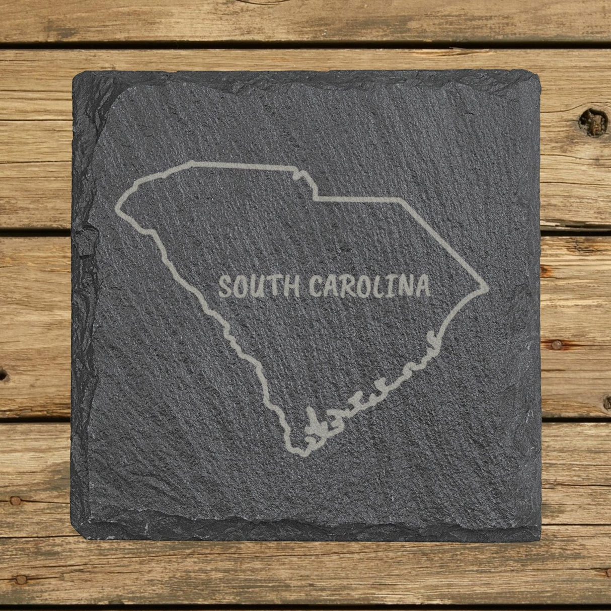 South Carolina square slate coaster engraved with the state outline and SOUTH CAROLINA in hand-drawn brush lettering