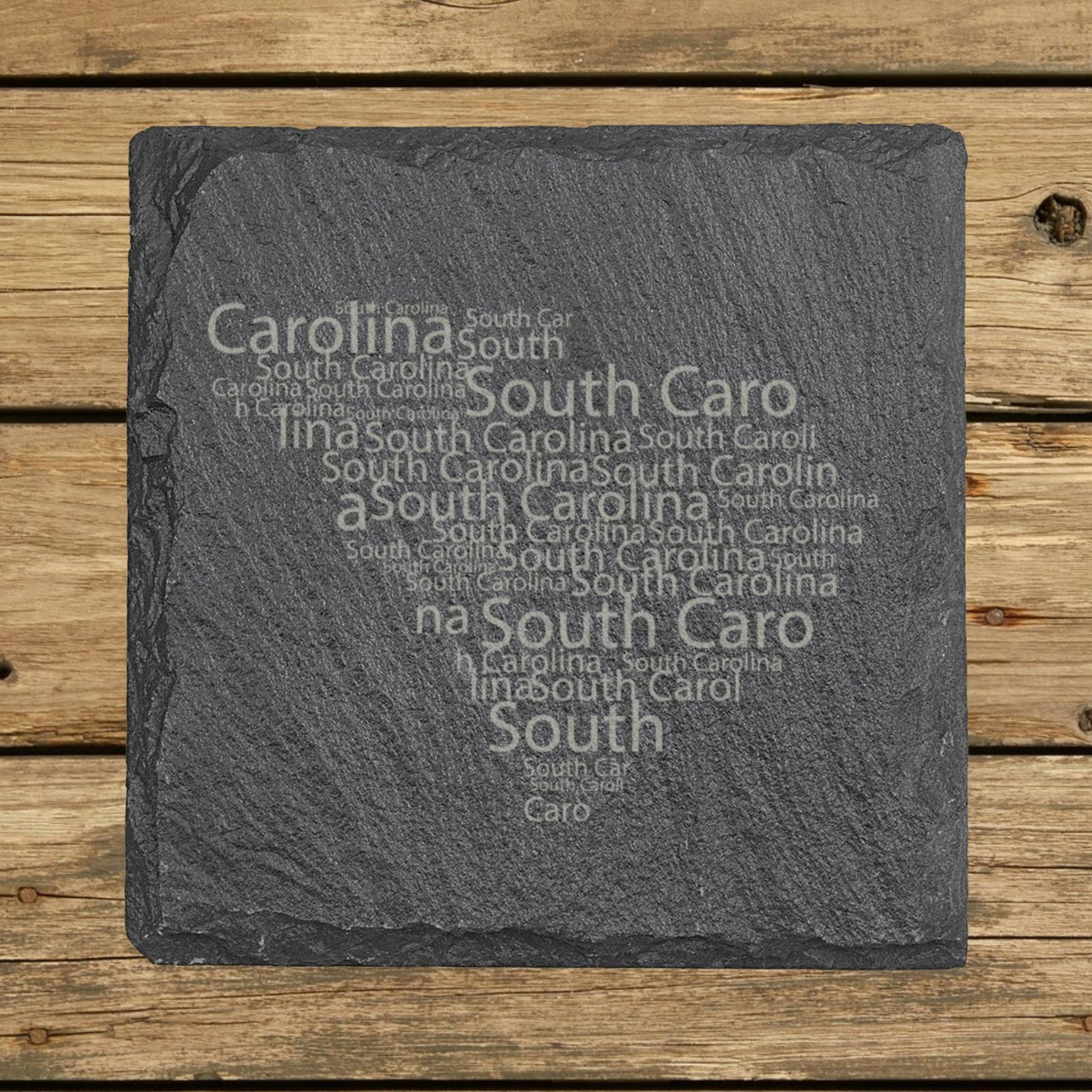 South Carolina square slate coaster engraved with a word cloud of repeating South Carolina text