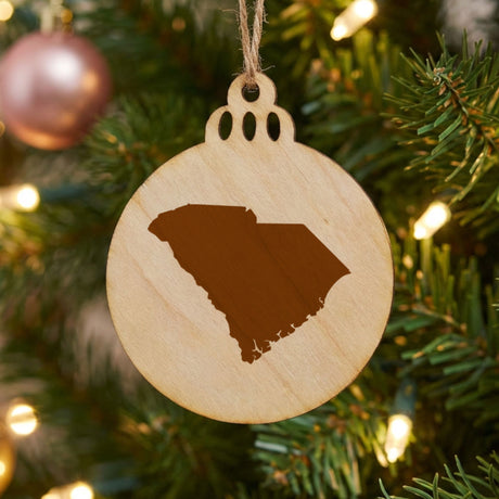 South Carolina round wood Christmas ornament with the full state shape engraved