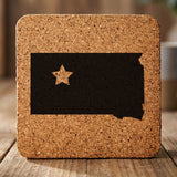 South Dakota square cork coaster engraved with the state shape and a star