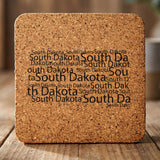 South Dakota square cork coaster engraved with a word cloud of repeating South Dakota text