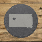 South Dakota round slate coaster engraved with the state shape and a heart