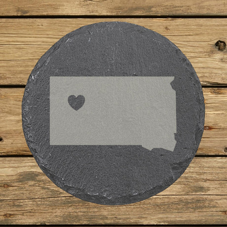 South Dakota round slate coaster engraved with the state shape and a heart
