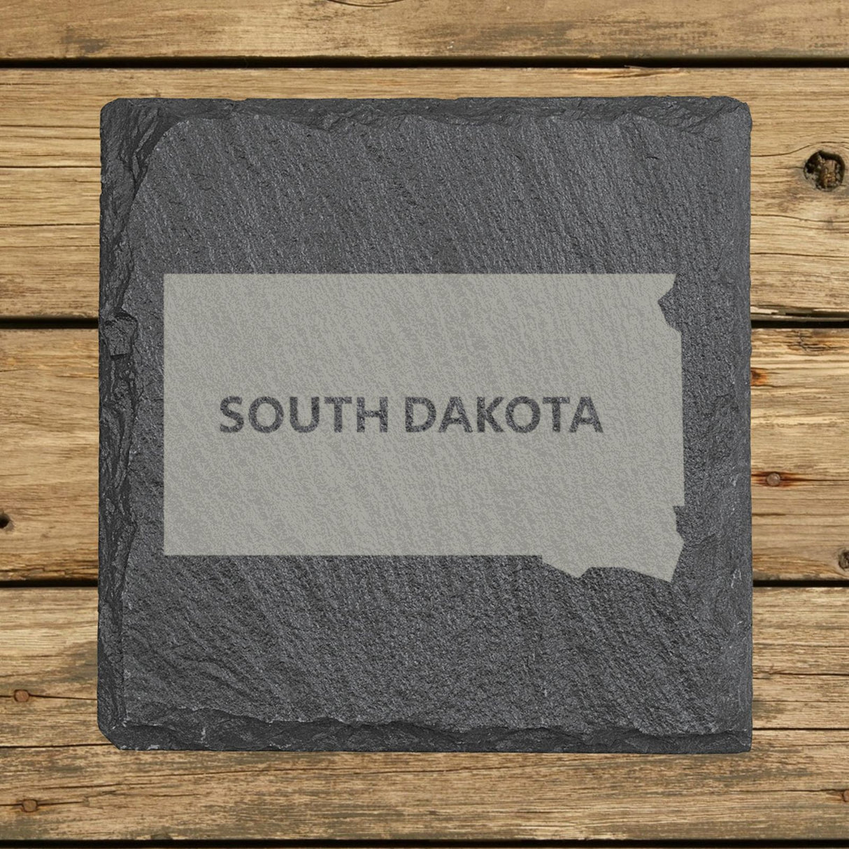 South Dakota square slate coaster engraved with the state shape and SOUTH DAKOTA in bold lettering