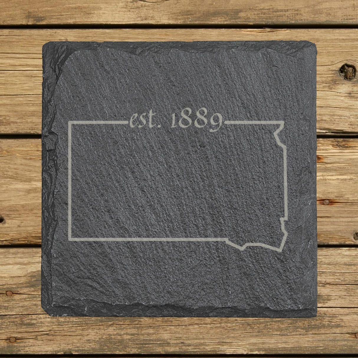 South Dakota square slate coaster engraved with the state outline and est. 1889
