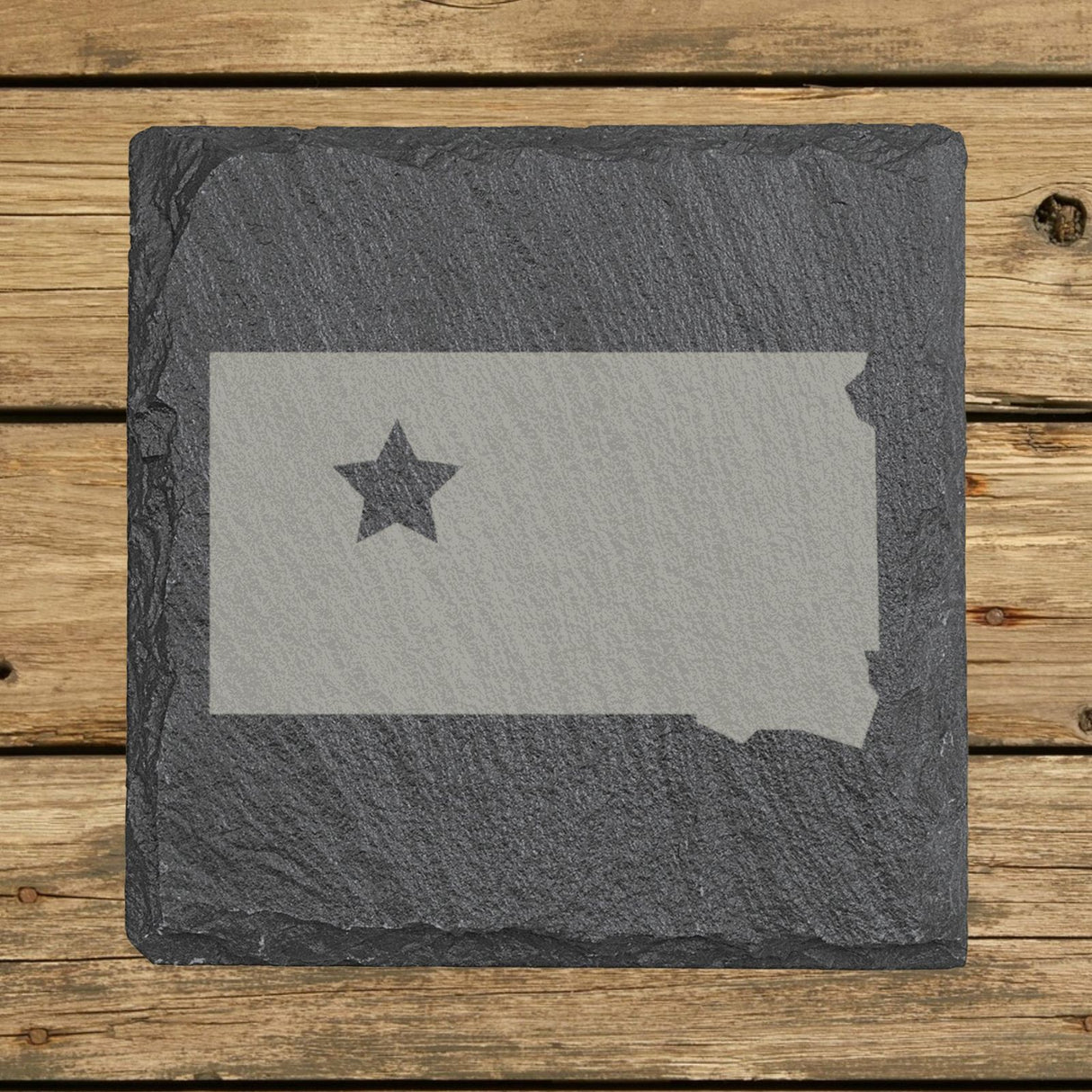 South Dakota square slate coaster engraved with the state shape and a star
